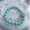 Nepalese Om with Turquoise Howlite Bracelet Nepalese Om with Turquoise Howlite Bracelet